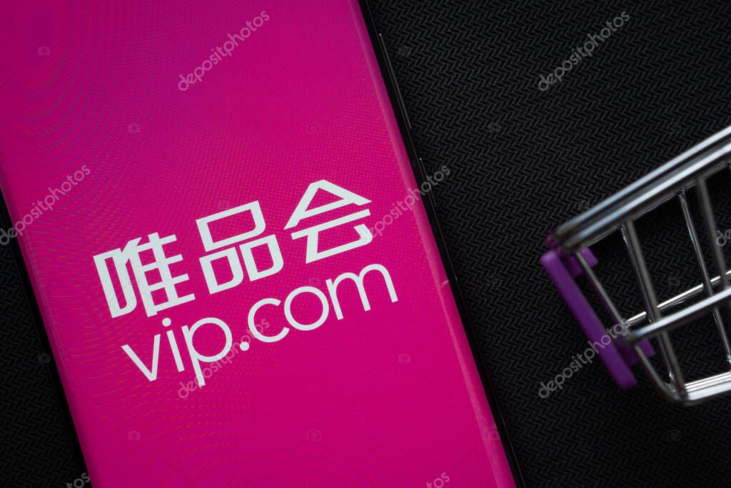 Dhaka, Bangladesh- 03 July 2025: A smartphone displaying the vip.com logo next to a miniature shopping cart on a background