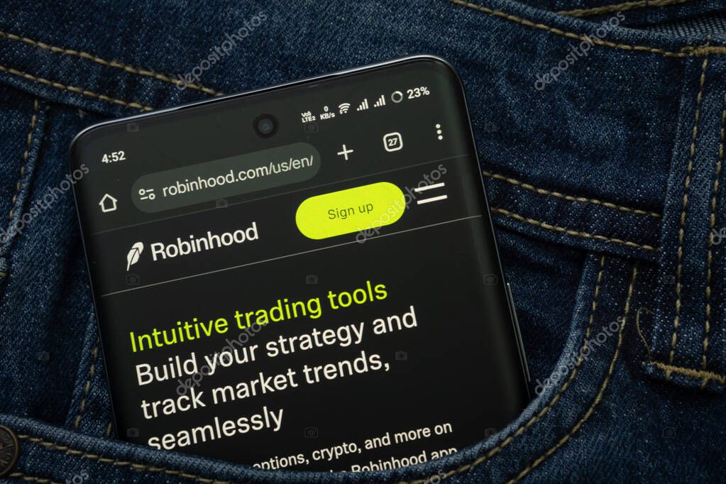 Dhaka, Bangladesh- 15 June 2025: A smartphone displaying the Robinhood web interface peeks out of a denim pocket.