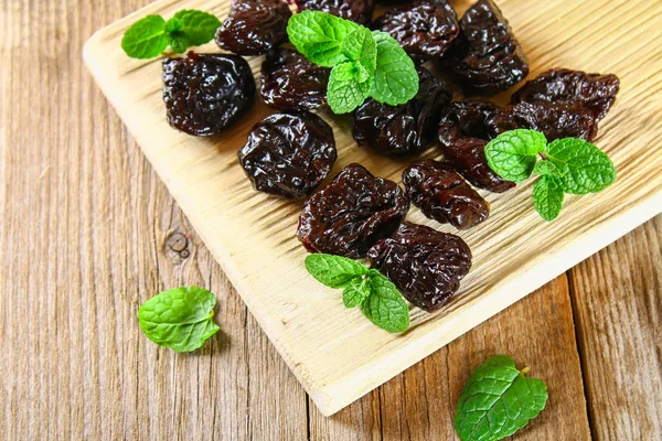 Prunes Mint Leaves Bowl Old Wooden Table — Stock Photo, Image