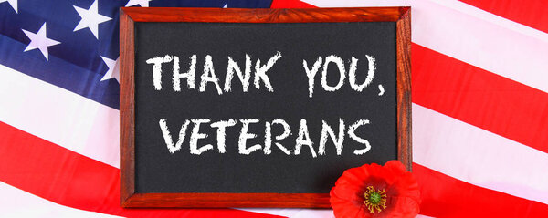 USA Memorial Day concept with calendar and red remembrance poppy on American stars and stripes flag