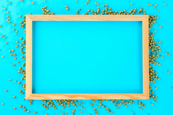 Een Houten Leeg Frame Een Pastel Achtergrond Omringd Door Glanzende — Stockfoto