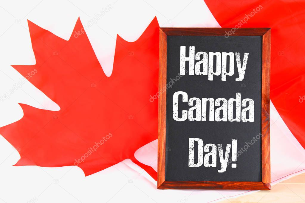 Chalkboard with the word Happy Canada Day on the national flag. Feast of 1 July