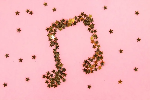 Musikaliska Noter Stjärnklara Gyllene Konfetti Liggande Rosa Pastell Bakgrund — Stockfoto