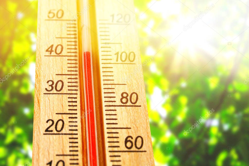 Thermometer displaying high 40 degree hot temperatures in sun summer day