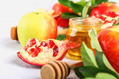 Rosh hashanah jewish New Year holiday concept. Traditional symbol. Apples, honey, pomegranate clipart