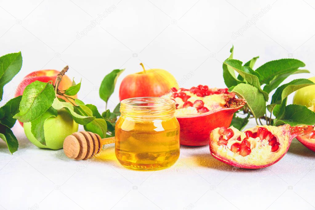 Rosh hashanah jewish New Year holiday concept. Traditional symbol. Apples, honey, pomegranate
