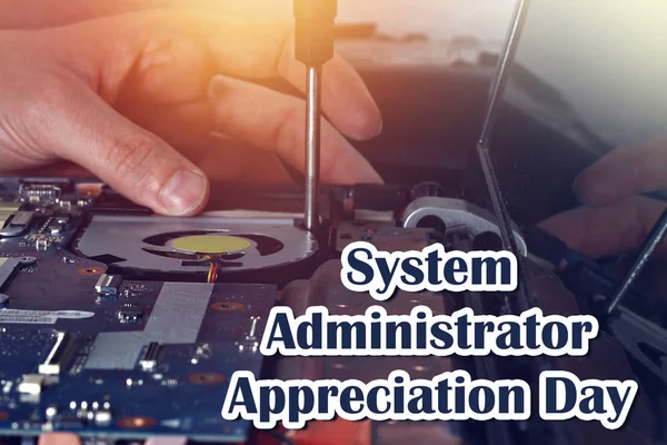 System Administrator Appreciation Day. Postcard for the holiday. The guy is fixing the laptop