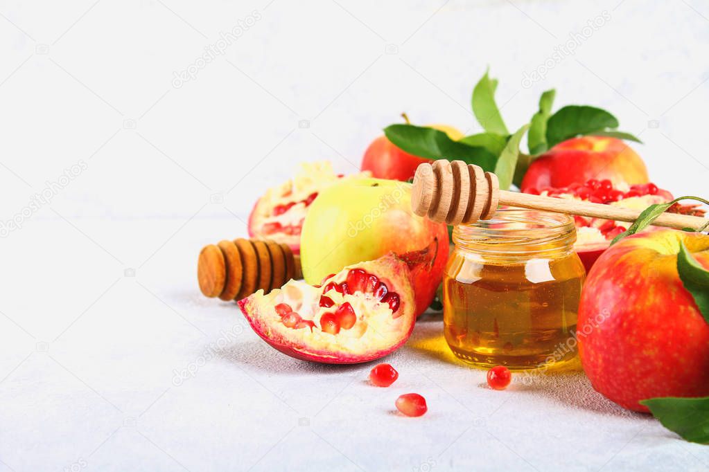 Rosh hashanah jewish New Year holiday concept. Traditional symbol. Apples, honey, pomegranate