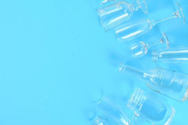 Glassware, glasses, jars on a pastel blue background. Flat lay, top view