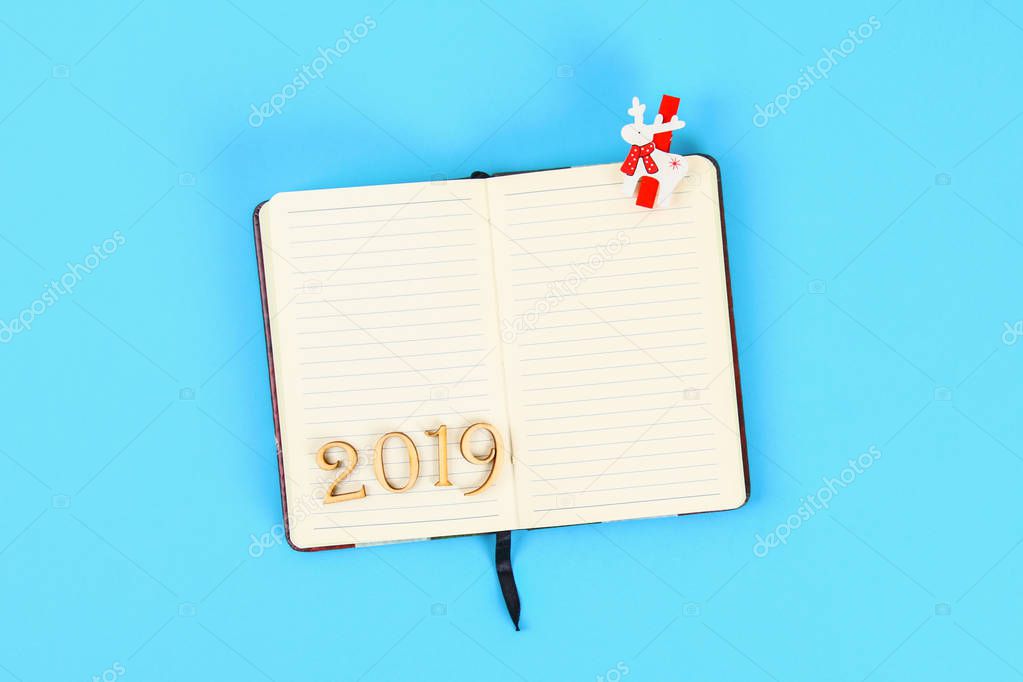2019 year. Blank notepad. Plans and goals for the year. Top view, flat lay