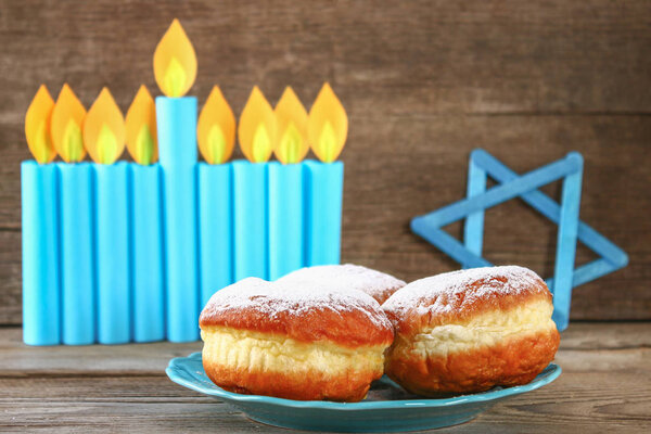 Еврейский праздник Ханука и его атрибуты, менора, пончики, Звезда Давида
