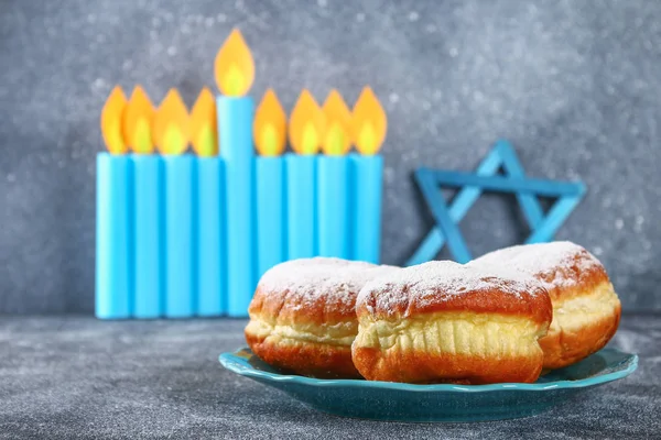 Jewish holiday Hanukkah and its attributes, menorah, donuts, Star of David. Hanukkah menorah. Hanukkah holiday. Jewish Hanukkah