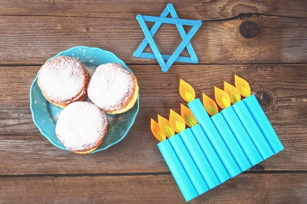 Jewish holiday Hanukkah and its attributes, menorah, donuts, Star of David. Hanukkah menorah. Hanukkah holiday. Jewish Hanukkah