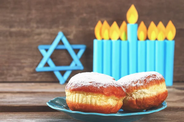 Jewish holiday Hanukkah and its attributes, menorah, donuts, Star of David. Hanukkah menorah. Hanukkah holiday. Jewish Hanukkah