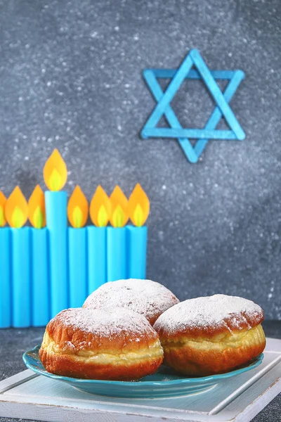 Jewish holiday Hanukkah and its attributes, menorah, donuts, Star of David. Hanukkah menorah. Hanukkah holiday. Jewish Hanukkah