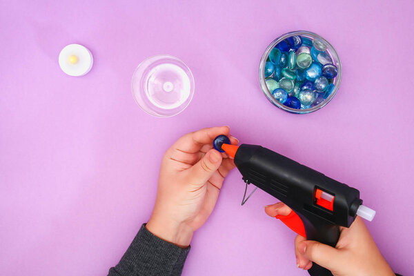 How to make your own candlestick from unnecessary glass or plastic and glass pebbles. Step by step. Christmas interior decor