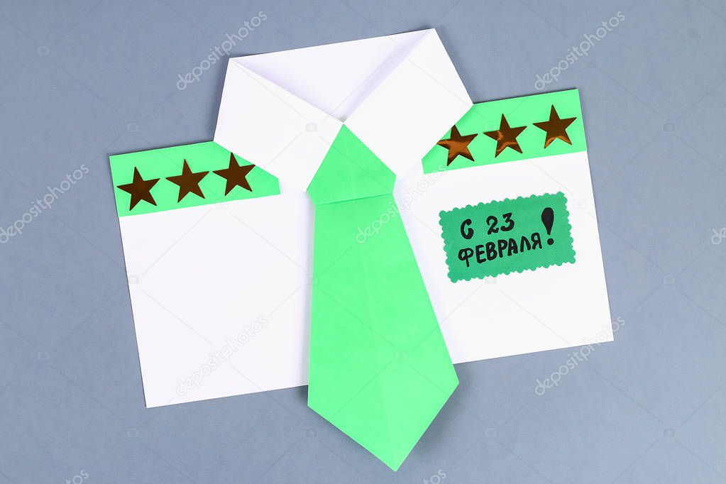 Diy white shirt paper with green tie, epaulets. Ideas gift, decor February 23, May 9, Father Day. Handmade. Step by step. process kid crafts. Top view. Greeting card on day defender fatherland.