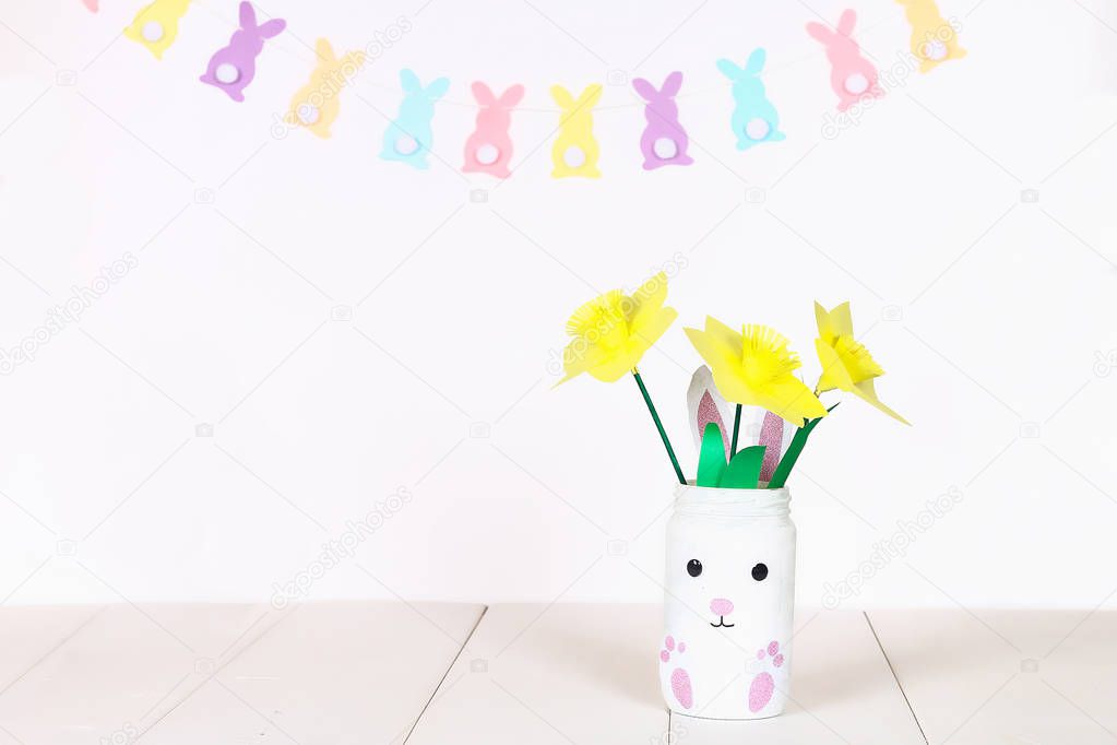 Diy Easter garland bunnies, flags EASTER made paper white wall background. Gift idea, decor Easter