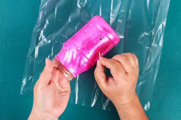 Diy Mothers Day vase with text from a glass jar, pink paint, sparkles glitter, stars, a gold ribbon — Stock Photo, Image