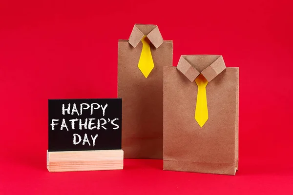 Craft packages gifts for father\'s day in the form of a shirt and tie. A gift for father day.