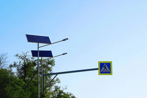 Solar cell lamp on sky background. Alternative energy from the sun. Light support with lantern