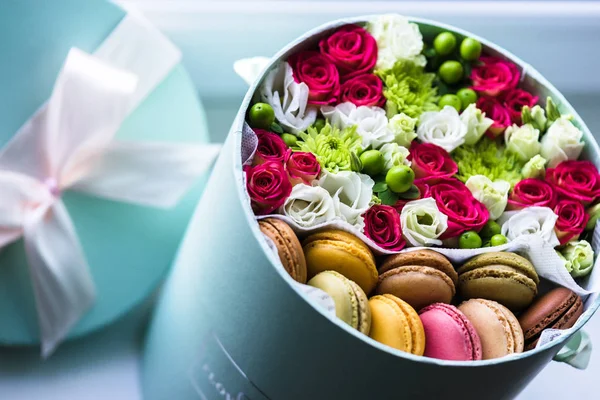 Flower box, Sweet Surprise Macarons and flowers closeup.