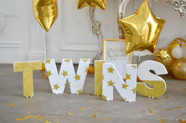Twins party. Decorations for birthday party. A lot balloons gold and white colors. Twins Birthday party.