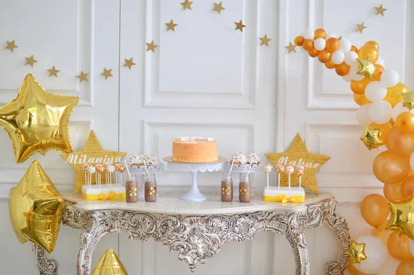 Twins party. Decorations for birthday party. A lot balloons gold and white colors. Twins Birthday party.