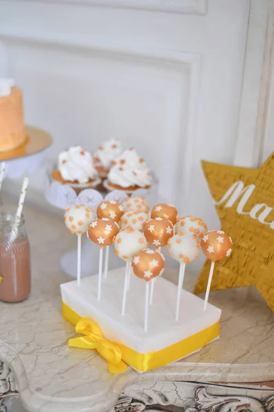 Decorations for birthday party. A lot of cakes. A lot of balloons red and white colors. One year birthday decorations. balloons pink and white colors. Ice cream party.