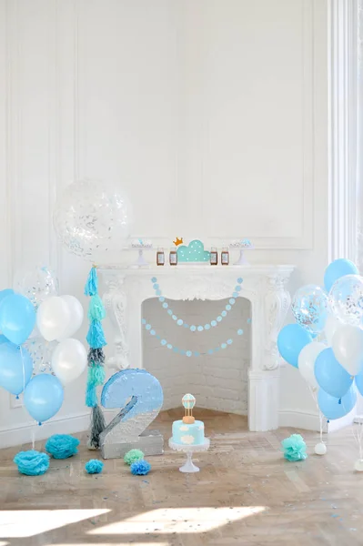 Decorations for holiday party. A lot of balloons blue and white colors. Decorations for birthday party. Two year birthday decorations.