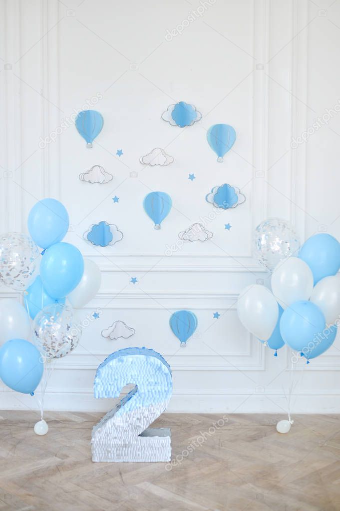 Decorations for holiday party. A lot of balloons blue and white colors. Decorations for birthday party. Two year birthday decorations. 