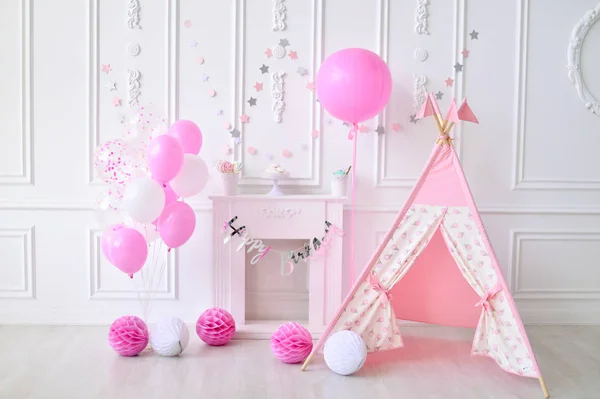 Girl birthday. Decorations for holiday party. A lot of balloons pink and white colors.