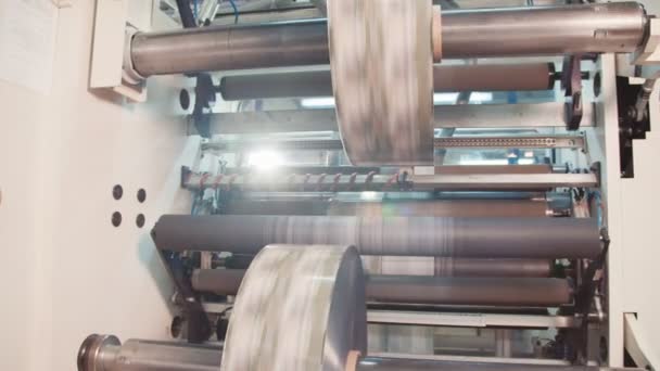 Printing press working at high speed in a large printing facility — Stock Video