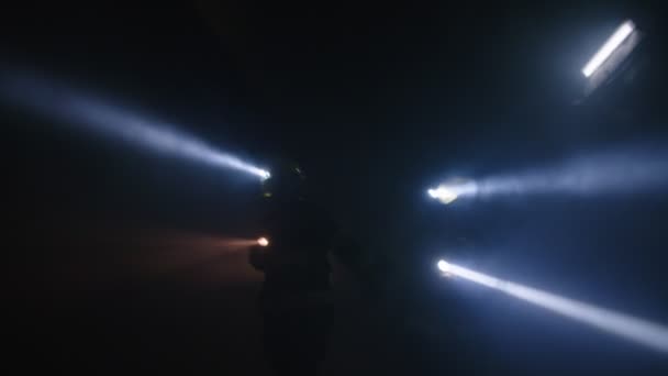 Firefighters during a rescue operation in a dark tunnel filled with smoke — Stock Video