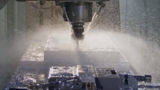 Slow motion of CNC mill manufacturing an advanced metal part — Stock Video