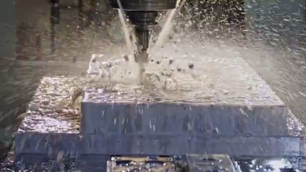 Slow motion of CNC mill manufacturing an advanced metal part — Stock Video