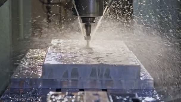 Slow motion of CNC mill manufacturing an advanced metal part — Stock Video