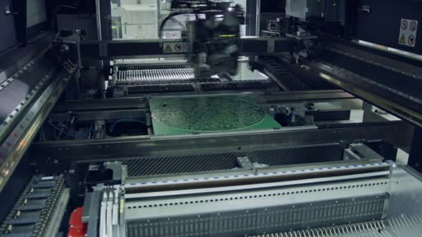 Surface Mount Technology SMT Machine places components on a circuit board — Stock Video