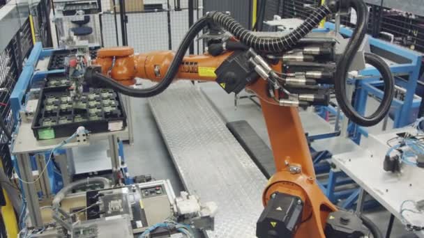 Robot working in an electronics manufacturing facility — Stock Video