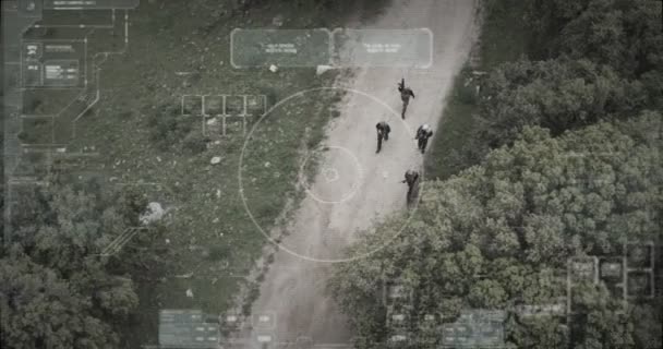 Surveillance drone camera view of terrorist squad walking with weapons — Stok Video