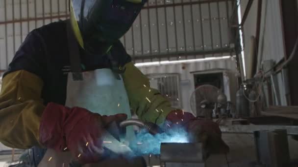 Slow motion of a welder welding construction steel frames — Stock Video