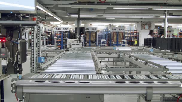 Boxes on a conveyor belt in a large automated warehouse — 비디오