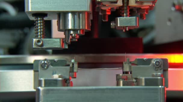 Advanced industrial production line for small parts, robotic arms working — Stock Video