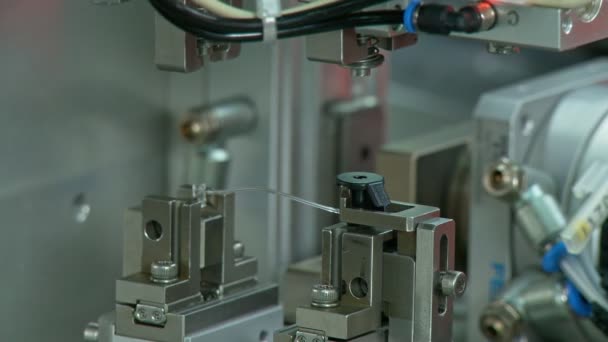 Advanced industrial production line for small parts, robotic arms working — Stock Video