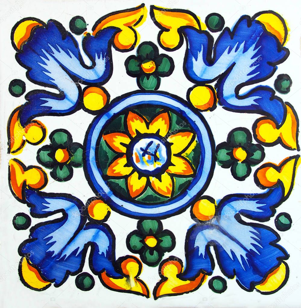 Detail of the traditional tiles from facade of old house. Decorative tiles.Valencian traditional tiles. Floral ornament.