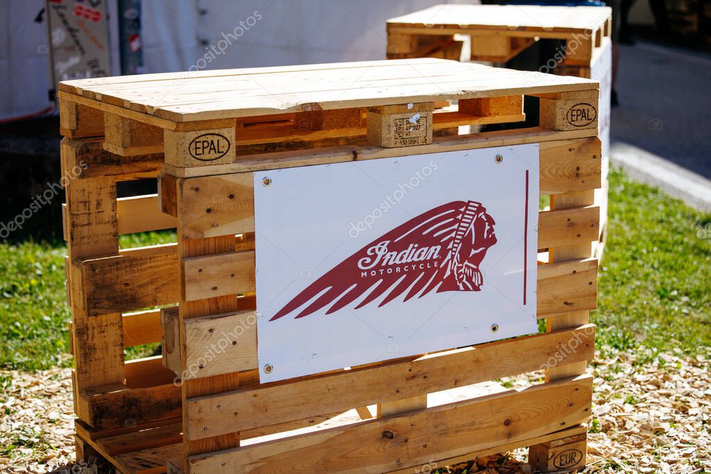 Faaker See, Austria - September 01, 2025: Indian Motorcycle wooden pallet display at European Bike Week, featuring the iconic logo in a lively outdoor atmosphere
