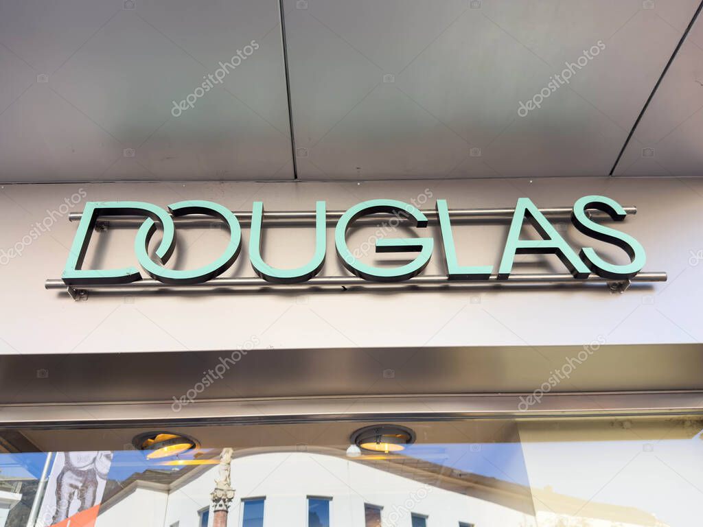 Lienz, Austria - September 18, 2025: Douglas brand sign is clearly visible on the building facade, highlighting its presence in a bustling shopping area