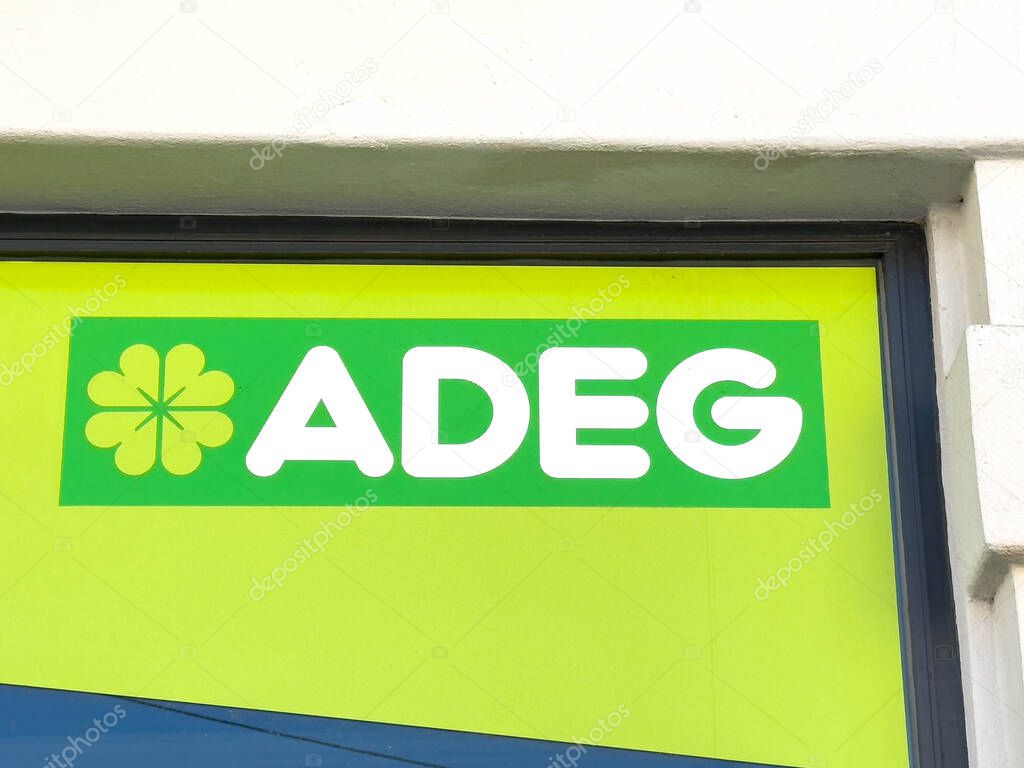 Wolfsberg, Austria - September 19, 2025: ADEG logo is featured on a bright green background, representing the brand's identity and welcoming vibe for shoppers