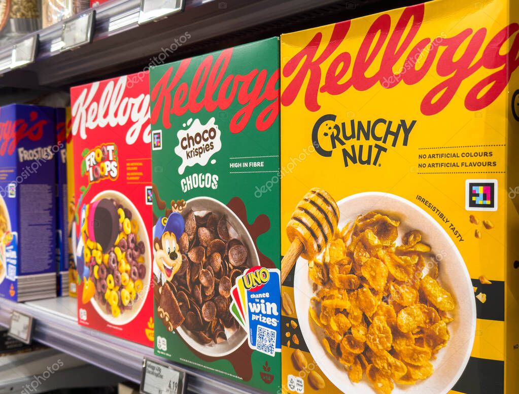 Bleiburg, Austria - September 19, 2025: Vibrant Kellogg's cereal boxes on supermarket shelf, featuring Frosties, Choco Krispies, and Crunchy Nut, highlighting colorful branding