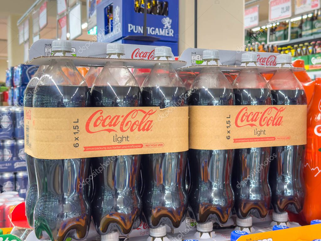 Bleiburg, Austria - September 19, 2025: Six-pack of Coca-Cola Light bottles arranged on supermarket shelf, highlighting colorful packaging and beverage choices